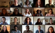 A team of people on an online conference call. Grid of webcam faces