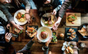 Overhead view of group of friends eating together